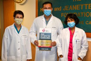 Doctors holding award