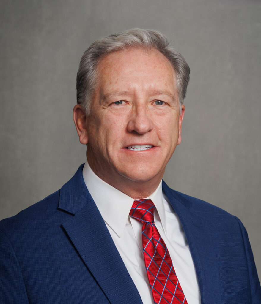 man in blue suit with red tie