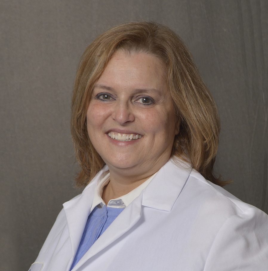 female physician with light colored shoulder length hair