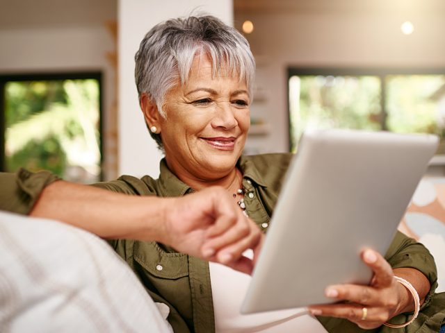 Senior on tablet